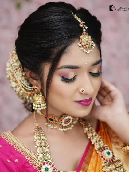 A close up of the intricate makeup from a creative photoshoot. The winged eyeliner, cut crease eyeshadow, and flawless base demonstrate a range of advanced techniques.