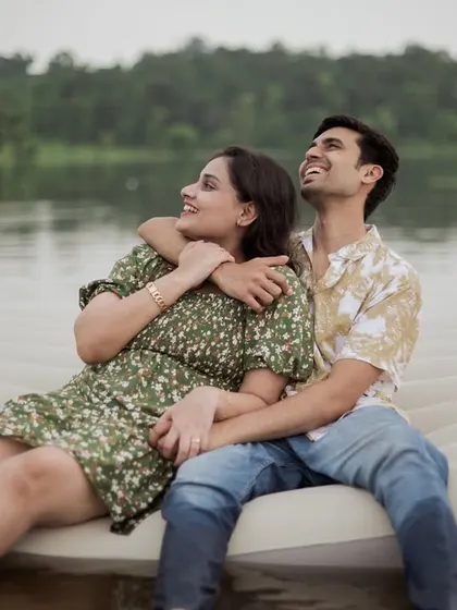 A candid moment of the couple looking out at the scenery, enjoying the peacefulness of the lake.