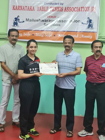 Deshna M receiving her certificate after winning the U-19 title at the state ranking tournament.