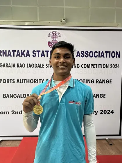 Ronak with his gold medal from the Air Rifle Men's Team event.