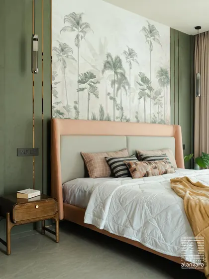 The focal point of this bedroom is the stunning palm-themed wallpaper, creating a tropical oasis. I designed the blush-pink upholstered bed frame and wooden nightstand to complement the feature wall perfectly.