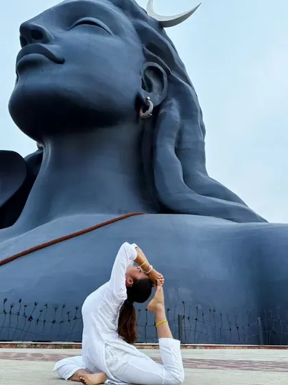 In a posture of surrender and devotion before the Adiyogi. Change is the essence of life, and this pose represents the willingness to surrender what you are for what you could become.