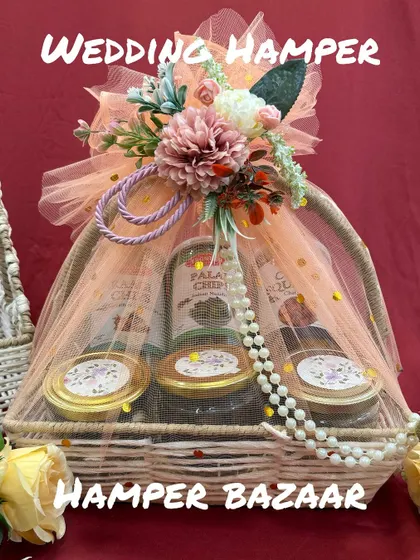 A wedding hamper should feel like a warm welcome. We designed this basket with healthy snacks and beautiful floral packaging to give guests a lovely, thoughtful gift as they join the celebrations.