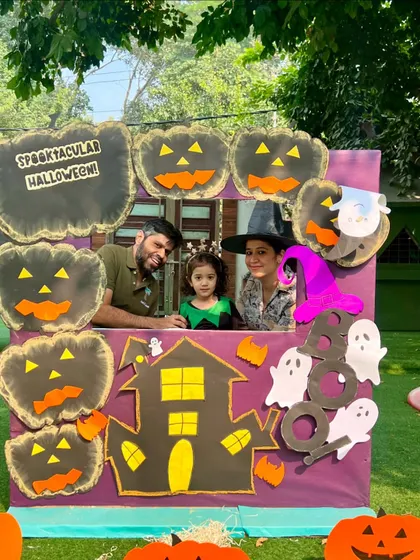 A family enjoys the Halloween festivities together. Our workshops are designed to be fun for the whole family, with creative activities and photo opportunities.