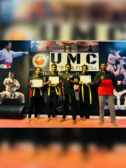 A group of our students who have all earned their yellow belts in kickboxing, recognized by WAKO Karnataka.