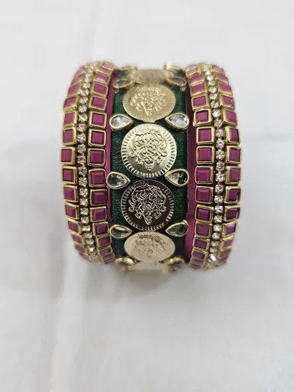 A final look at the stunning green and pink bridal bangle set, a testament to handmade luxury.