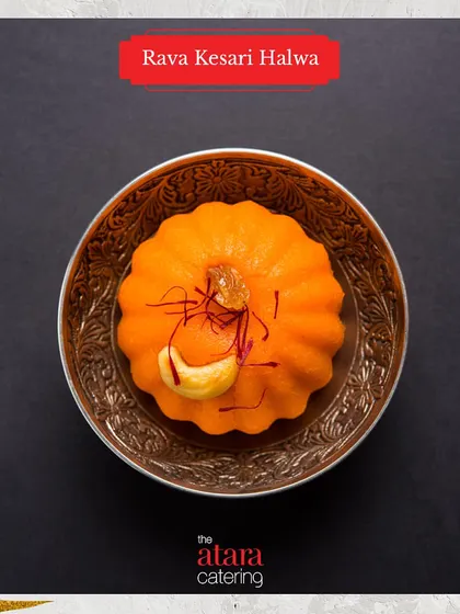 A beautifully molded Rava Kesari Halwa. This saffron-infused semolina dessert is a rich and aromatic sweet treat from our Indian dessert menu.
