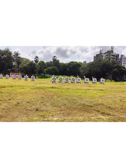 A wide-angle view of the competition range in Mumbai, showing multiple targets set up across the field for a large-scale event.