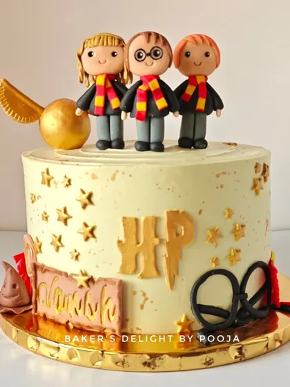 Turning ten is a magical milestone, especially with this Harry Potter themed cake. It features adorable, handcrafted fondant figures of Harry, Ron, and Hermione, along with a golden snitch and other wizarding world details.