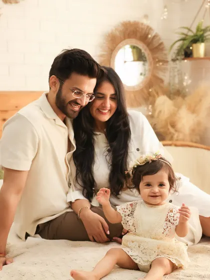 A cozy and intimate family portrait on our studio bed setup. The natural textures and warm tones create a relaxed atmosphere, perfect for capturing genuine smiles.