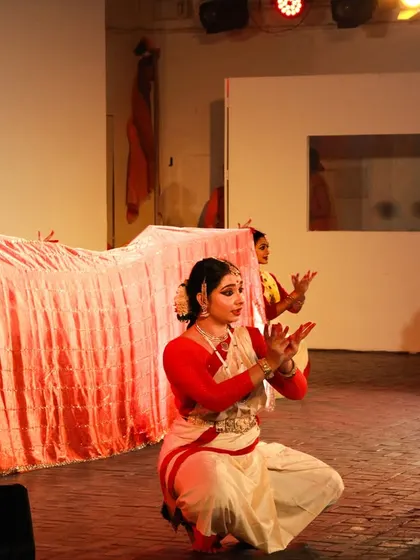 A scene from 'Mix & Match' at the Triveni Amphitheatre. The use of fabric in motion is central to this production, creating fluid, dynamic visuals that pay tribute to the texture and flow of the saree.