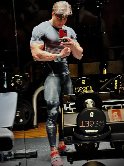 A full body shot in compression gear, showing the physique of a warrior who defies defeat.