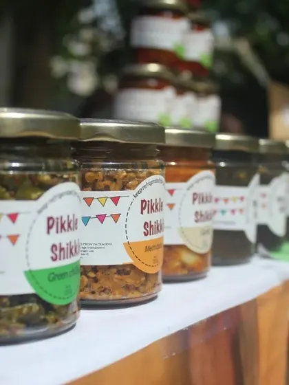 A row of my homemade pickles, showcasing the different colours and textures. Each jar is filled with authentic, natural goodness.