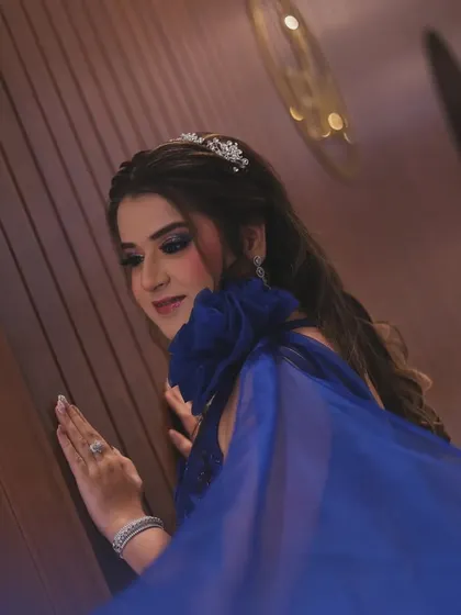 Stepping into forever. A beautiful shot of the bride in her royal blue gown, with the flowing fabric adding a sense of movement and grace.