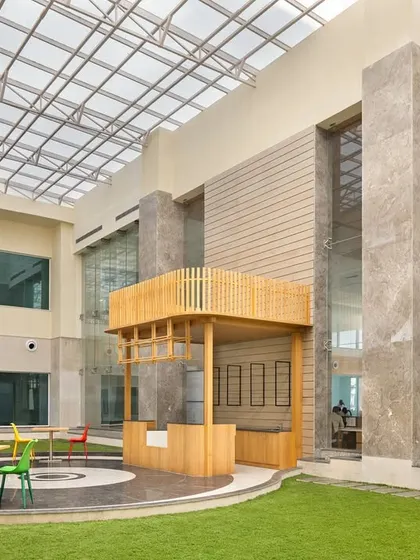 The sunlit central atrium at Pragma Medical Institute in Bhatinda is a core element of our evidence-based design. This biophilic space, with its greenery and seating, is integrated to ease anxiety and aid recovery.