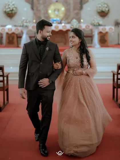 A couple walks down the aisle after their church wedding, sharing a happy glance. I capture both the solemnity and the joy of Christian ceremonies.