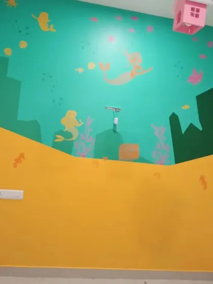 A whimsical mermaid and sea life mural in progress, designed to transform a child's bedroom into a magical underwater world.