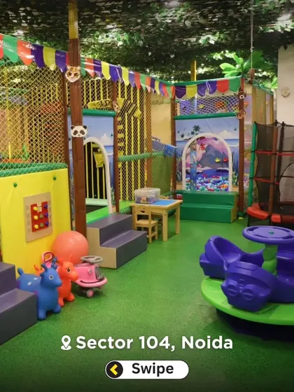 This photo gives a good sense of the layout, with the toddler-friendly rockers and merry-go-round in the foreground and the larger play structure behind.
