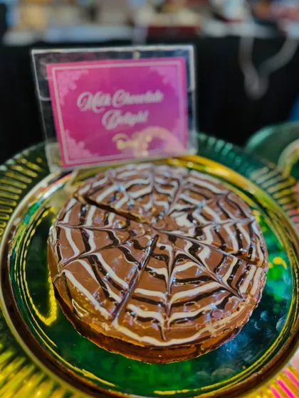 A close-up of the Milk Chocolate Delight waffle, pre-sliced for easy serving.