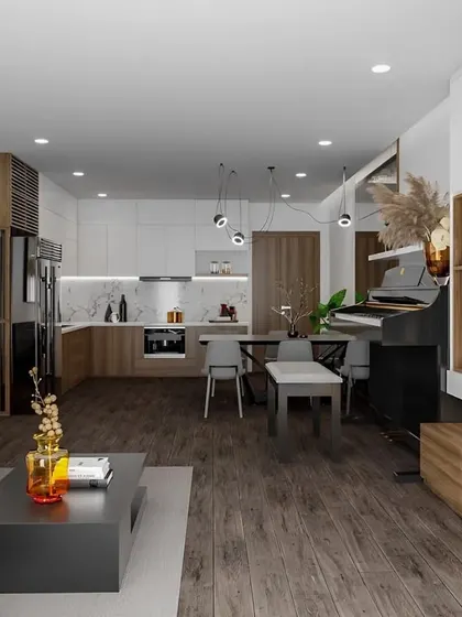 An open-concept living area where the kitchen, dining, and living spaces flow into one another. The consistent use of dark wood flooring and a neutral color scheme creates a cohesive and spacious feel.