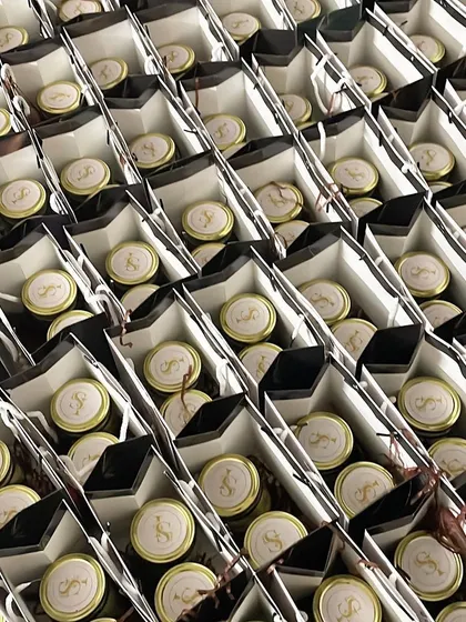 Consistency is key for bulk orders. Each of these return gift bags for an engagement party is identical, showcasing our commitment to quality at scale.