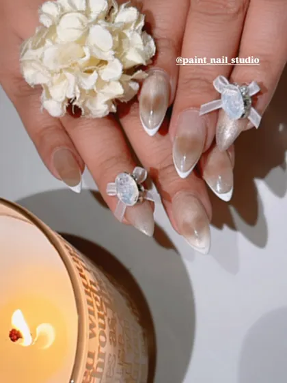 The coquette trend is everything right now, and I’m bringing it to life with these 3D bows. This design features a soft, cat-eye base with a clean white French tip, accented with delicate, hand-sculpted bows and gems. It’s the perfect mix of sweet and sophisticated.
