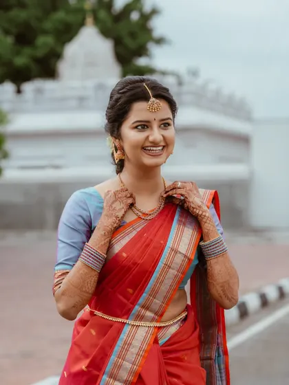 A joyful candid of the bride. Her smile says it all. The natural makeup enhances her happiness, creating a look that is both beautiful and full of life.
