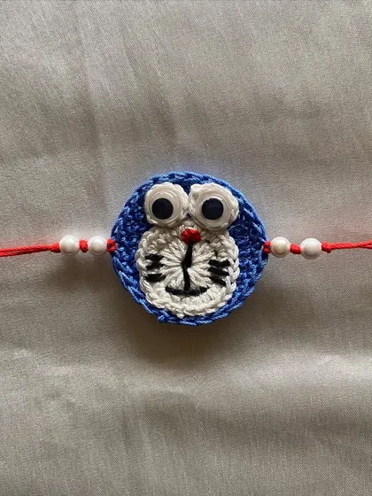 A detailed close-up of our crochet Doraemon rakhi. We take care to capture the details of beloved characters to make the festival extra special for little ones.