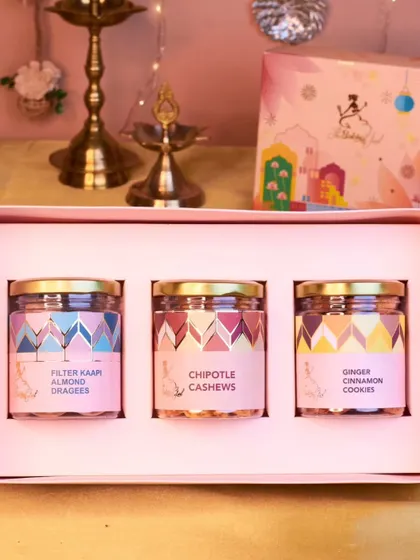 This box of nibbles is perfect for every palate, featuring a jar of Filter Kaapi Almonds, spicy Chipotle Cashews, and sweet Ginger Cinnamon Cookies. A trio of flavors for your Diwali celebrations.