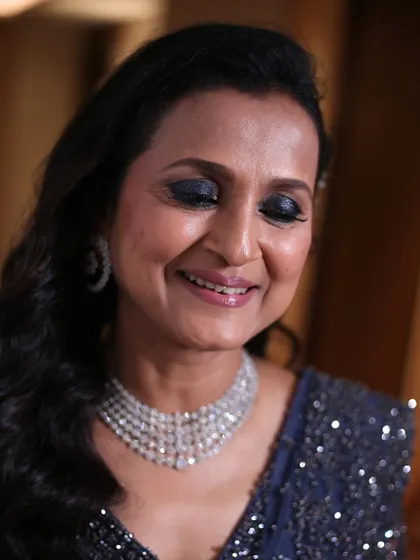 When the groom's mom steals the show. This glamorous look features a dramatic smokey eye and a flawless base, proving that bold makeup can be beautiful at any age.