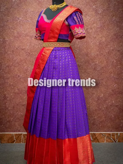 The vibrant colors of this half saree make it a joyful choice for any celebration.
