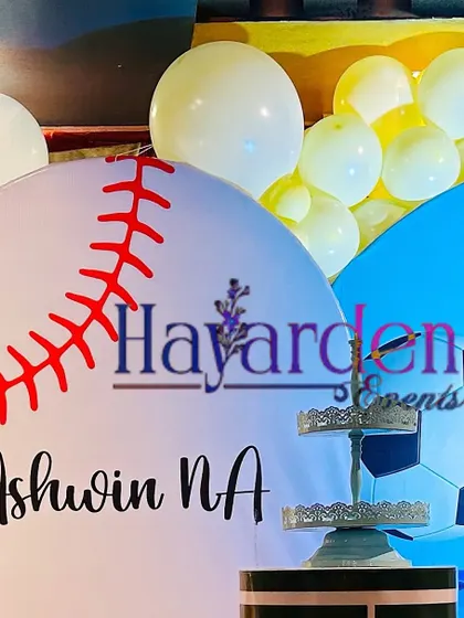 A custom baseball-themed backdrop, part of a multi-sport party decoration.