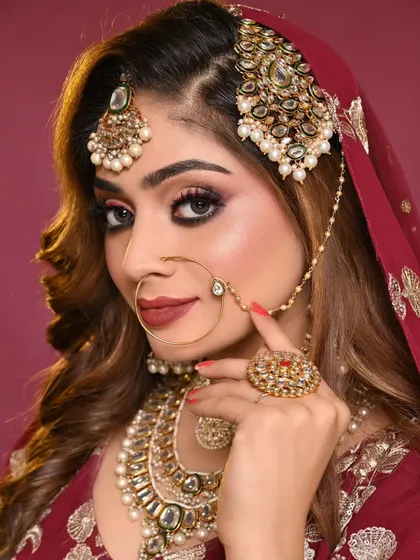 A close up of a stunning bridal look created by one of my students. Notice the sharp winged liner, the seamless blend of the eyeshadow, and the perfectly defined lips. This level of precision is what I teach.