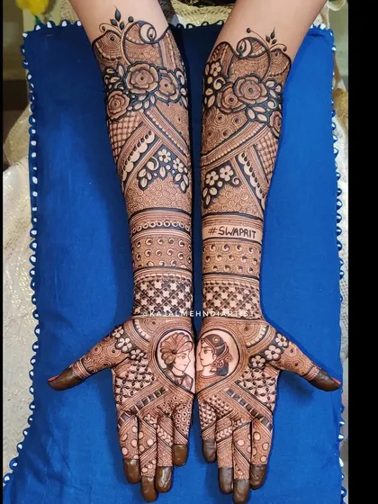 A lovely heart-shaped frame for this couple's portrait, symbolizing their union. I love adding names and personal touches to make the bridal henna feel extra special and completely customized.