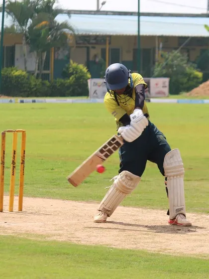 We are committed to promoting women's cricket. This action shot from a women's tournament captures a batter in perfect form, highlighting the competitive and high-skill matches hosted at our academy.