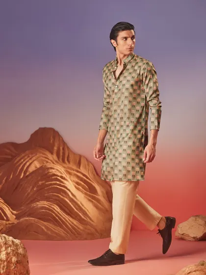 From the Wadi Collection, this printed kurta features a unique geometric pattern in earthy tones, offering an artistic and contemporary option for festive dressing.