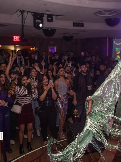A drag performer commanding the stage at Bollywood Disco. Our parties celebrate all forms of artistry and self expression, and the drag performances are always a highlight.