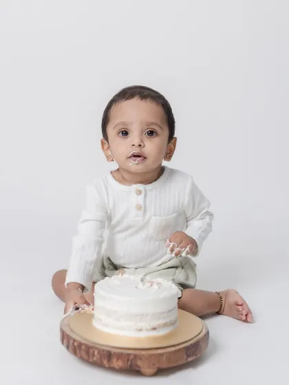 A sweet portrait of the birthday boy with his cake, before the smashing began.