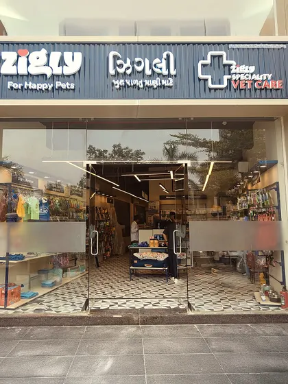 The welcoming glass entrance of our Ahmedabad store, showcasing the clean, organized layout and the specialty vet care sign.