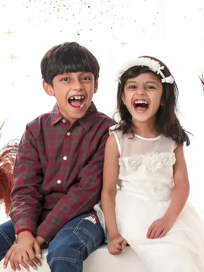 There's nothing like the sound of siblings laughing together. I love capturing these genuine, unscripted moments of joy that you'll cherish for a lifetime.