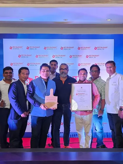 Our team posing with the "Caterer of the Year" award.