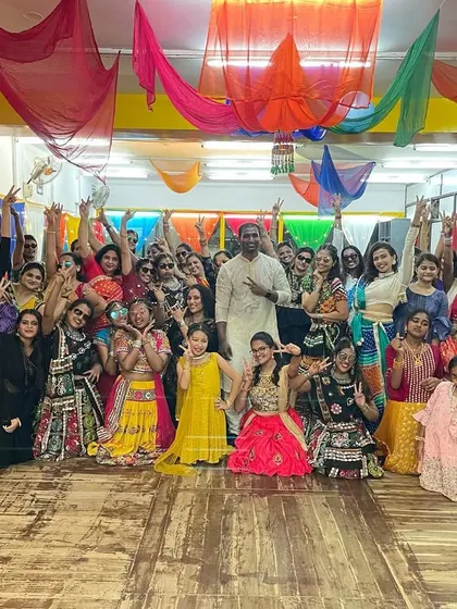 A huge group photo from one of our vibrant Dandiya night events. Beyond weddings, I love bringing communities together with the joy of dance for festive occasions and special workshops.