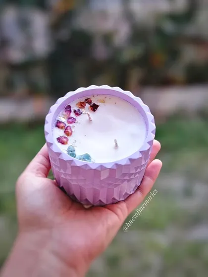 This is currently my largest candle, a beautiful diamond-cut jar in a lovely lavender color. The soy wax is topped with dried rose petals and crystals. The jar can be repurposed as a planter after use.