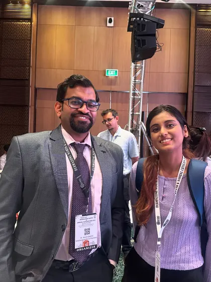 A candid moment with a colleague at a conference. These events are not just about presentations, but also about networking and building connections with the next generation of dermatologists.