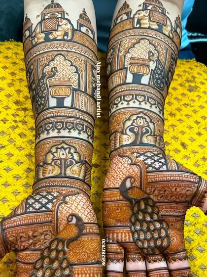 Another view of the peacock design, showing the full arms. The top of the design features palace architecture and elephants.