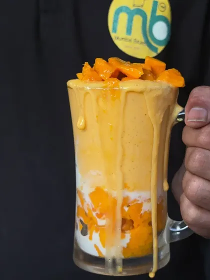 The wait is over! My Mango Feast is here. This picture shows my delicious mango shake, a perfect treat for the summer season.
