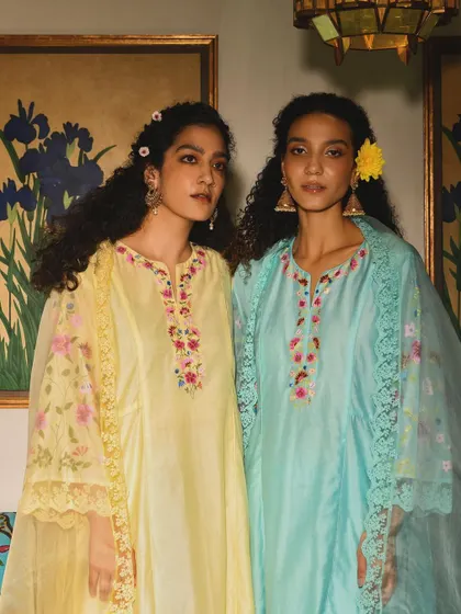 A lovely shot of two models for Baavli, showcasing complementary outfits in pastel shades. It tells a story of friendship and celebration.