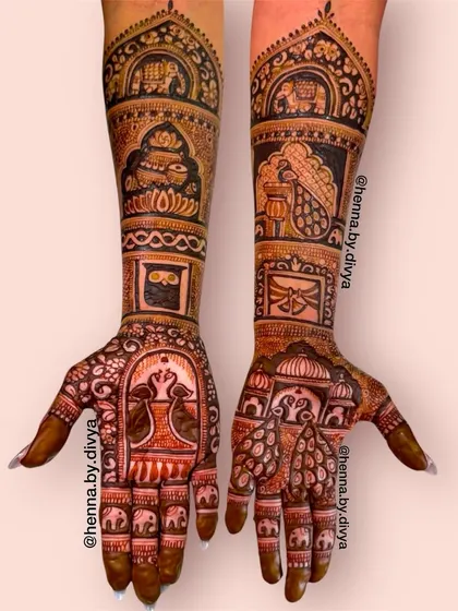 A classic full-coverage bridal design featuring traditional wedding symbols. The arms are decorated with panels showing a doli, kalash, and other auspicious motifs.
