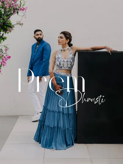 A stylish, editorial-style portrait of a couple at their pre-wedding carnival party.