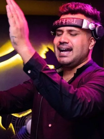 Hands up, feeling the music. I get as into the set as the crowd does. It's a shared experience.